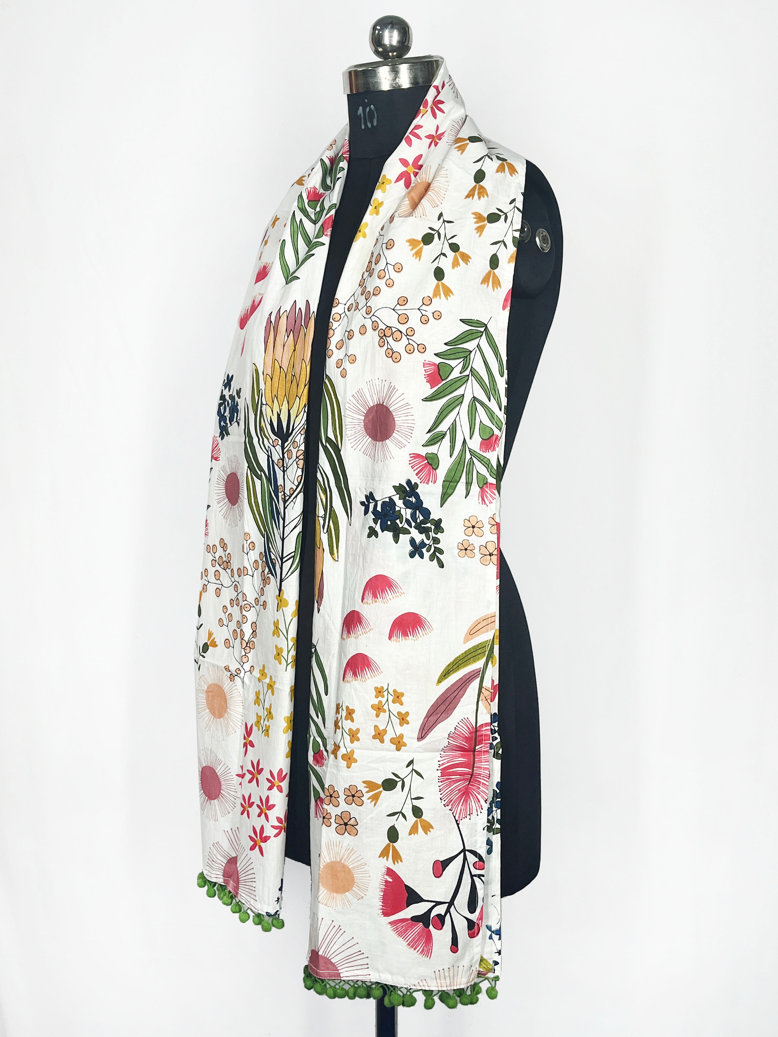 White Botanical Print Scarf with Green Pom-Pom Trim – Vibrant Floral Accessory