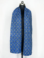 Pom-pom trim and an intricate paisley print adorn this royal blue scarf 22x72 Inch