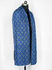 Pom-pom trim and an intricate paisley print adorn this royal blue scarf 22x72 Inch