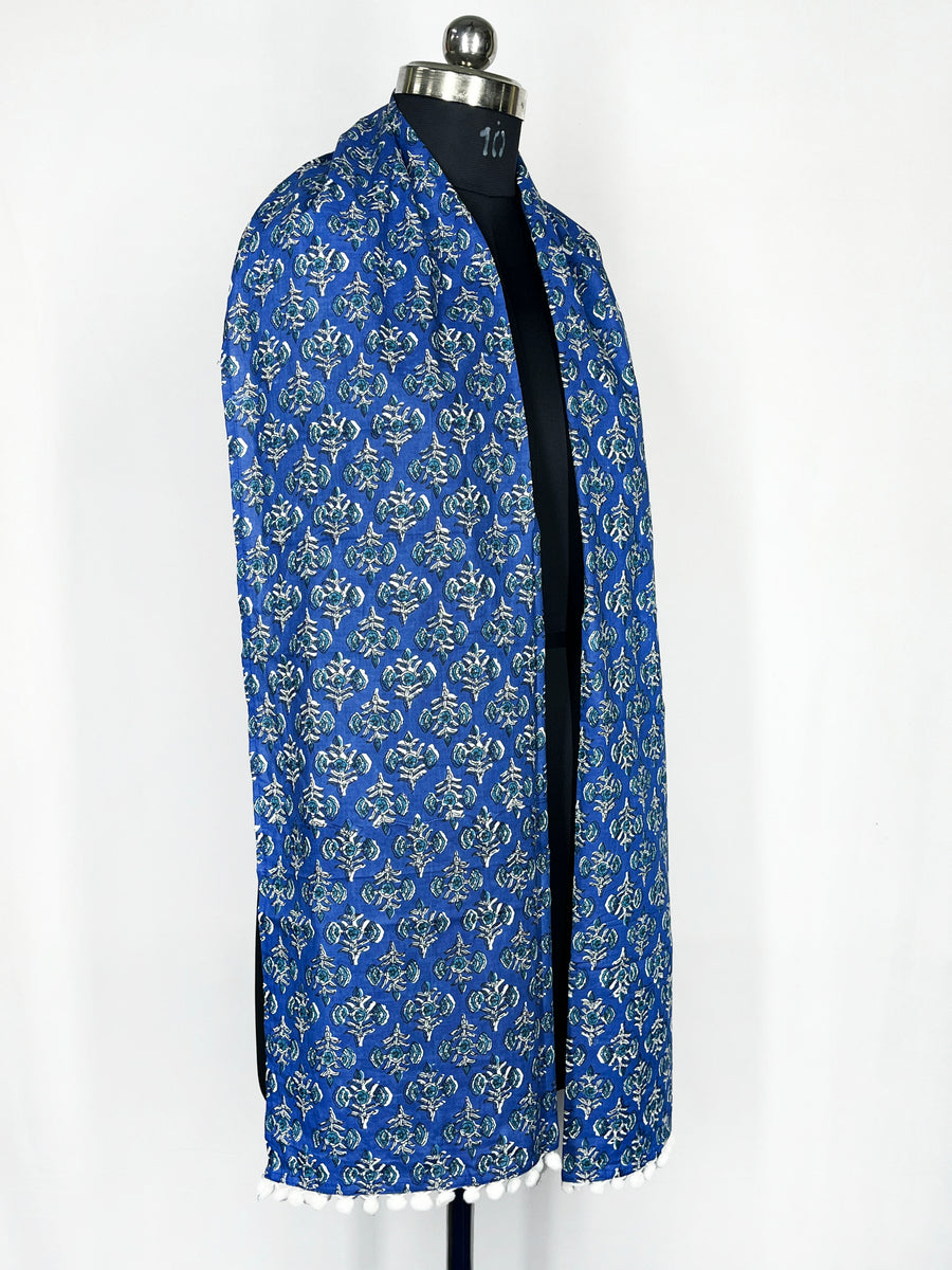 Pom-pom trim and an intricate paisley print adorn this royal blue scarf 22x72 Inch