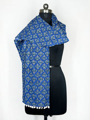 Pom-pom trim and an intricate paisley print adorn this royal blue scarf 22x72 Inch