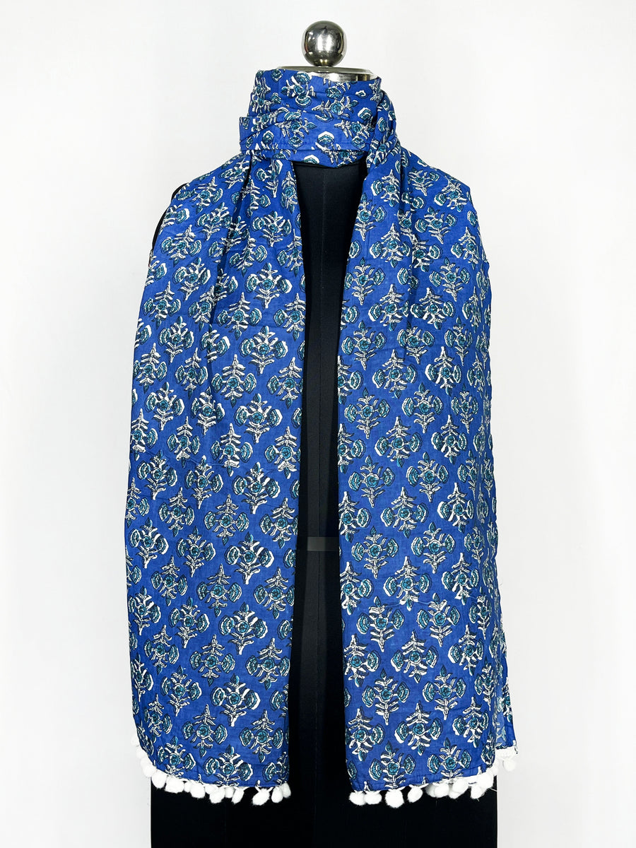 Pom-pom trim and an intricate paisley print adorn this royal blue scarf 22x72 Inch